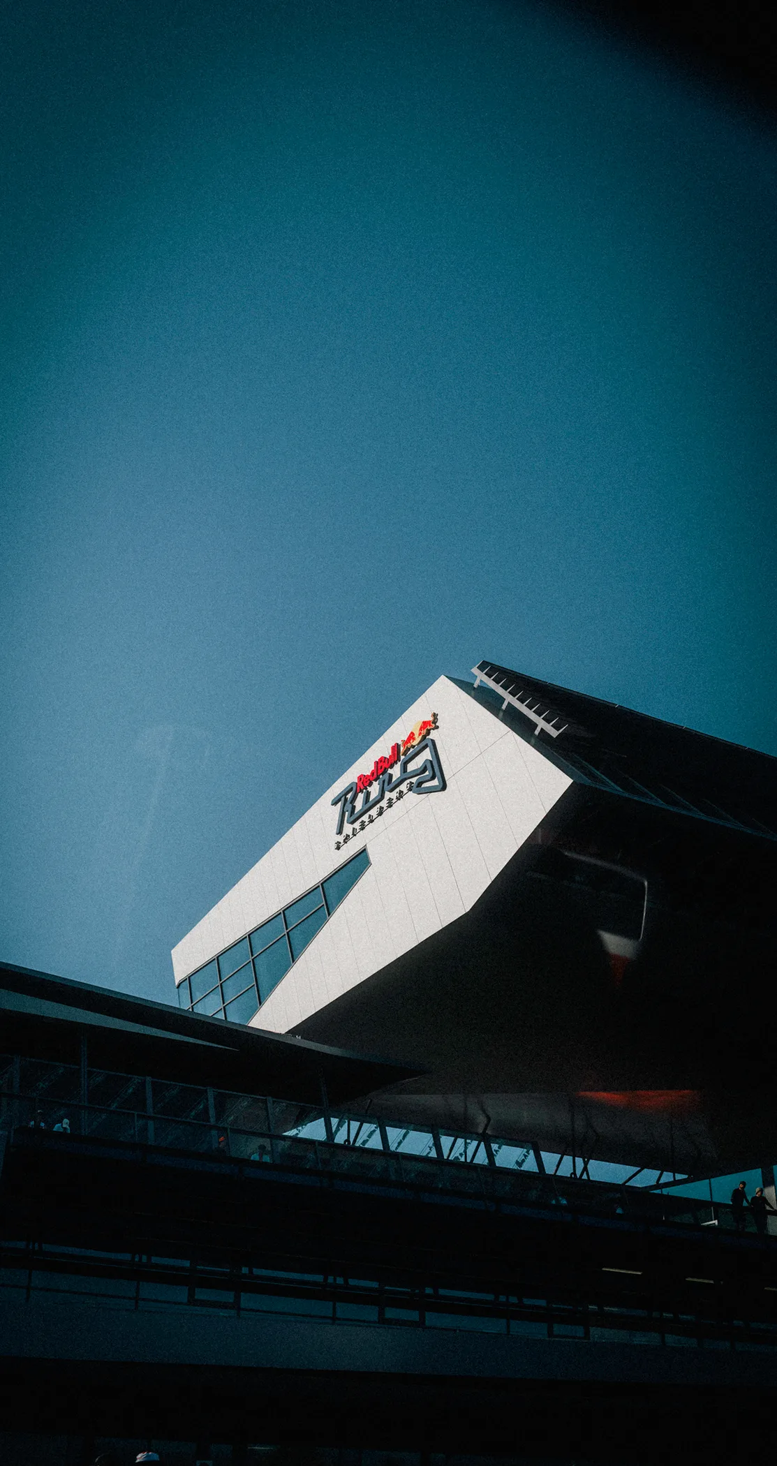 Dusk sky and moon above the Formula 1 logo